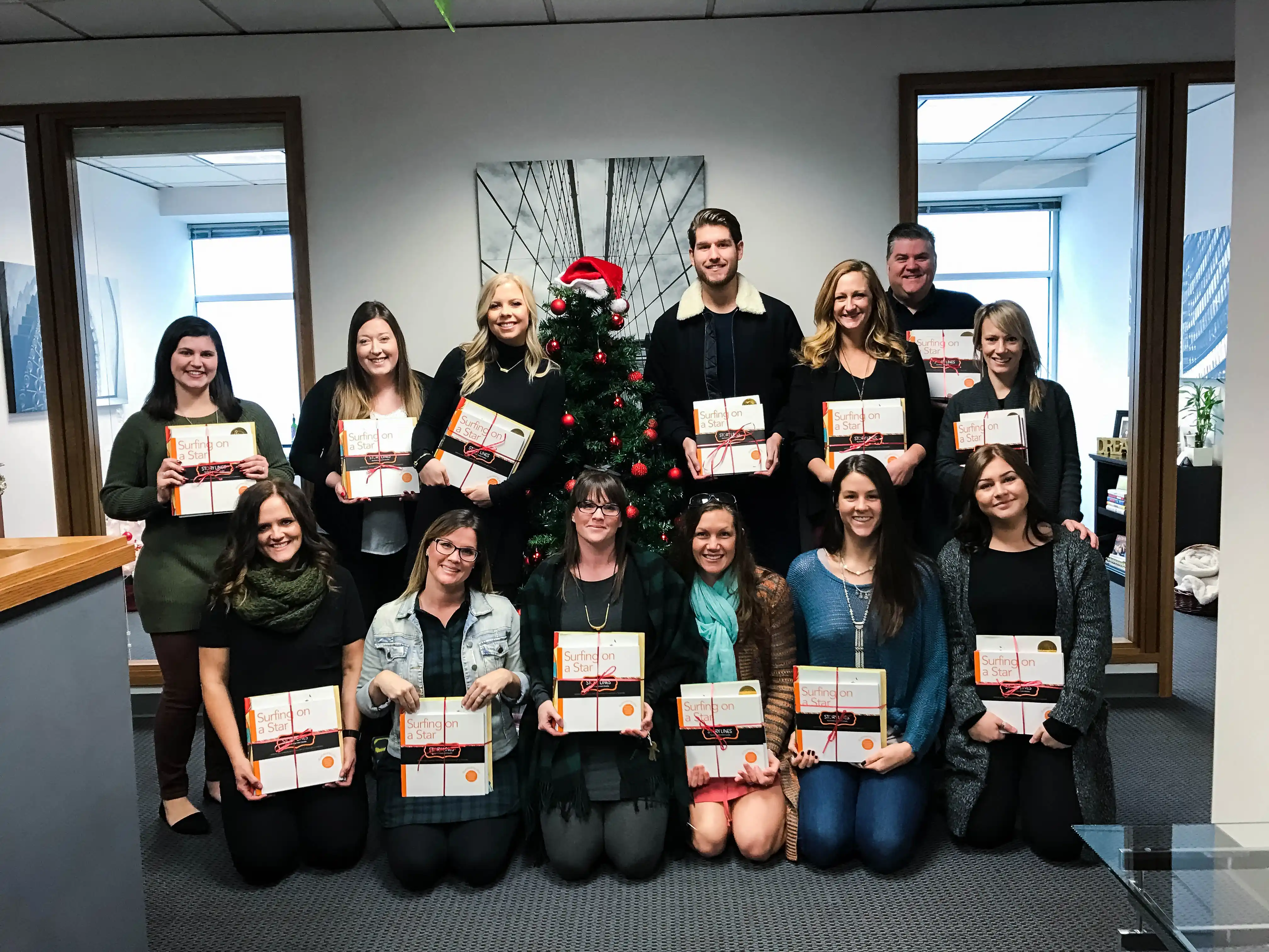 Lamb Real Estate Team Book Donations to The Christmas House
